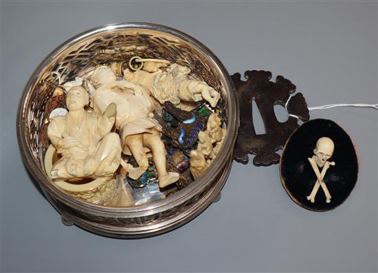A collection of Japanese ivory carvings, memento mori, a plated caster, a tsuba etc